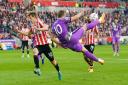 Tottenham Hotspur's Harry Kane tries an acrobatic effort at Brentford