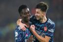 Arsenal's Bukayo Saka (left) celebrates with team-mate Kieran Tierney after scoring their side's third goal of the game at Elland Road