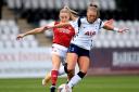 Tottenham Hotspur's Rianna Dean (right) and Arsenal's Leah Williamson battle for the ball during the FA Women's Super League match at Meadow Park, London.
