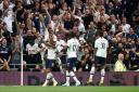 Tottenham Hotspur's Harry Kane (left) celebrates scoring his side's second goal of the game against Aston Villa with team mates (pic: John Walton/PA Images).