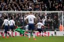 Tottenham Hotspur's Harry Kane scores his side's first goal of the game from the penalty spot during the Premier League match against Arsenal at Wembley Stadium (pic: John Walton/PA Images).