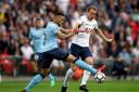 Tottenham Hotspur's Harry Kane (right) and Newcastle United's Jamaal Lascelles (left) battle for the ball during the Premier League match at Wembley Stadium (pic: Nick Potts/PA Images).