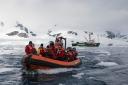 Greenpeace crew in an inflatable visit Neko Harbour in Andvord Bay (home of a Gentoo penguin colony), Antarctic Peninsula.  Picture: Daniel Beltra/Greenpeace