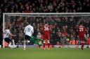 Tottenham Hotspur's Harry Kane scores his side's second goal of the game from the penalty spot during the Premier League match at Anfield against Liverpool (pic: Peter Byrne/PA Images).