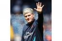 Pat Rice waves to the fans