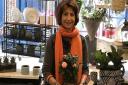 Judy Green holds a plant inside her Garden Store in Flask Walk, Hampstead. Picture: Catherine Wiltshire
