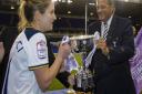 Tottenham Ladies captain Jenna Schillaci receives the FA Women's Premier League Southern Division trophy from Gary Mabbutt (pic wusphotography.com)