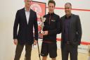 Men's winner Charles Sharpes (centre) with tournament director Zubair Khan (right) and Anthony Todd of the competition's primary sponsor, Aspect Capital