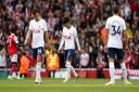 Tottenham players appear dejected during the North London derby defeat at Arsenal