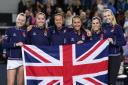 Great Britain pose with the Union Jack flag after beating Sweden in the Billie Jean King Cup play-off at the Copper Box Arena. Image: PA