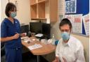 Dr Opat, from Cranwich Road Surgery in Stamford Hill, receiving a vaccine administered by Dr Cerian Choi.