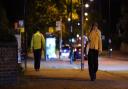 A woman walking after dark in London