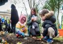 Wentworth nursery pupils plant bulbs in the newly opened Kit Crowley Gardens