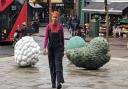 Artist Veronica Ryan and her Windrush sculptures in Narroway Square by St Augustin's Tower.