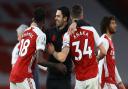 Arsenal manager Mikel Arteta (centre) celebrates with Thomas Partey (left) and Granit Xhaka after the Premier League match at Emirates Stadium, London. Picture date: Sunday March 14, 2021.