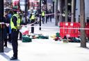 Police officers at the scene after three people were taken to hospital following reports of stabbings at Bishopsgate on October 6