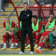 Leyton Orient head coach Richie Wellens looks on from the dugout