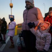 A family from Ukraine cross the border point from Ukraine into Medyka, Poland on March 19