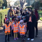 St Mary School students walking with Kelly-Marie in Stoke Newington