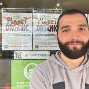 Sulayman Sucu, 25, who manages Figs & Grain, is one of many who oppose the Planet Organic opening in Broadway Market.