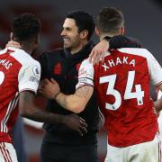 Arsenal manager Mikel Arteta (centre) celebrates with Thomas Partey (left) and Granit Xhaka after the Premier League match at Emirates Stadium, London. Picture date: Sunday March 14, 2021.