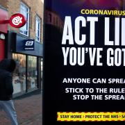 A government coronavirus warning sign warns of the dangers of Covid.