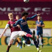 Burnley's Ben Mee (left) and Arsenal's Willian (right) battle for the ball during the Premier League match at Turf Moor, Burnley. Picture date: Saturday March 6, 2021.