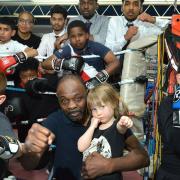 James Cook MBE with young boxers in the gym at Pedro Boxing Club