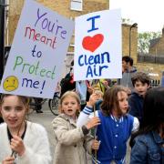 Children and parents from William Patten Primary Schools march down Church Street in April to protest against road closure plans they said would worsen air quality. Picture: Polly Hancock