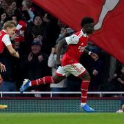 Arsenal\'s Bukayo Saka (right) celebrates scoring their third goal against Liverpool