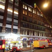 Firefighters tackle a blaze at a restaurant in Shoreditch High Street, believed to have been caused by grease in the extractor system catching fire