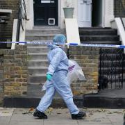 Forensics outside the house in Montague Road, Hackney