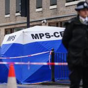 A police forensic tent in Shoreditch near to the scene of the fatal stabbing