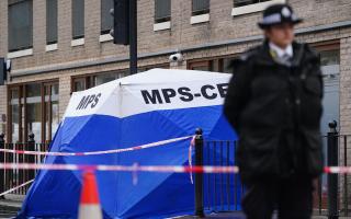 A police forensic tent in Shoreditch near to the scene of the fatal stabbing
